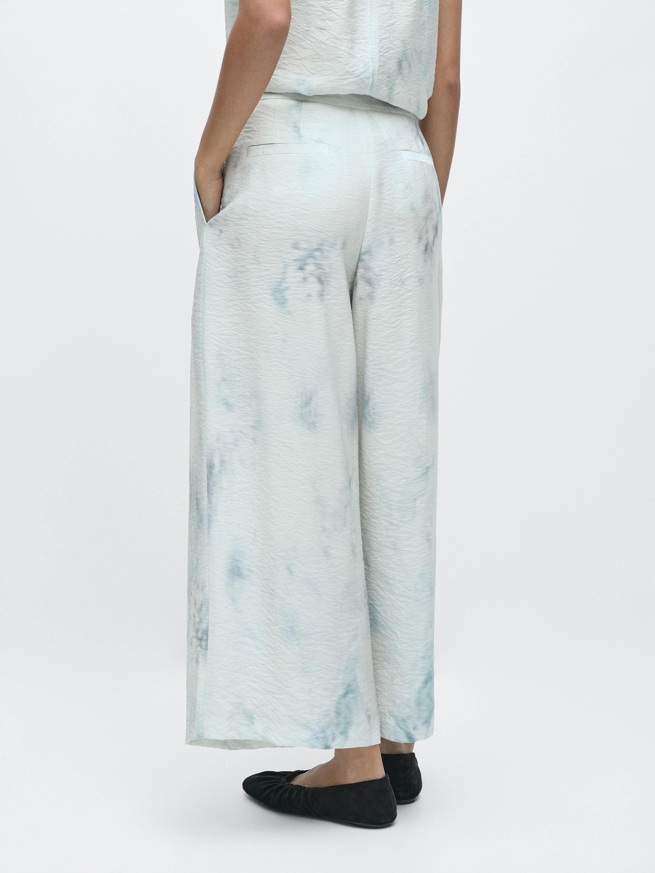 Printed trousers with pleat details